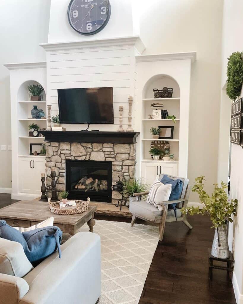 TV Hanging Over White Fireplace