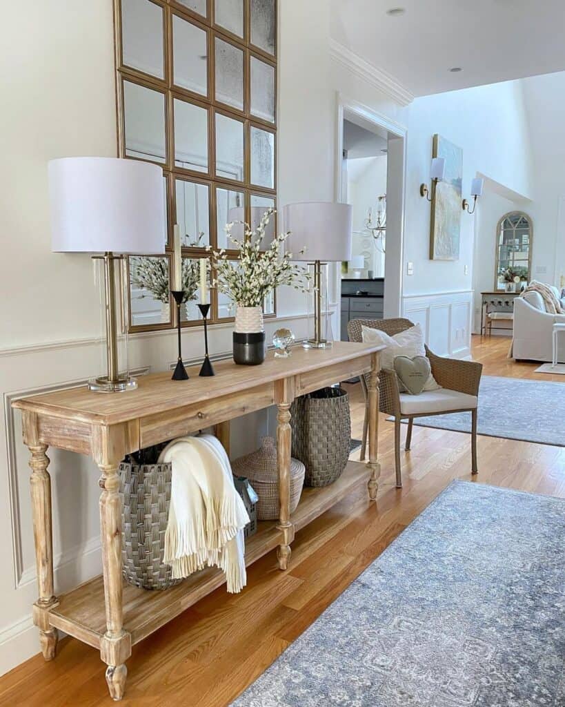 Tall Metal Lamps Sitting on a Wood Console Table