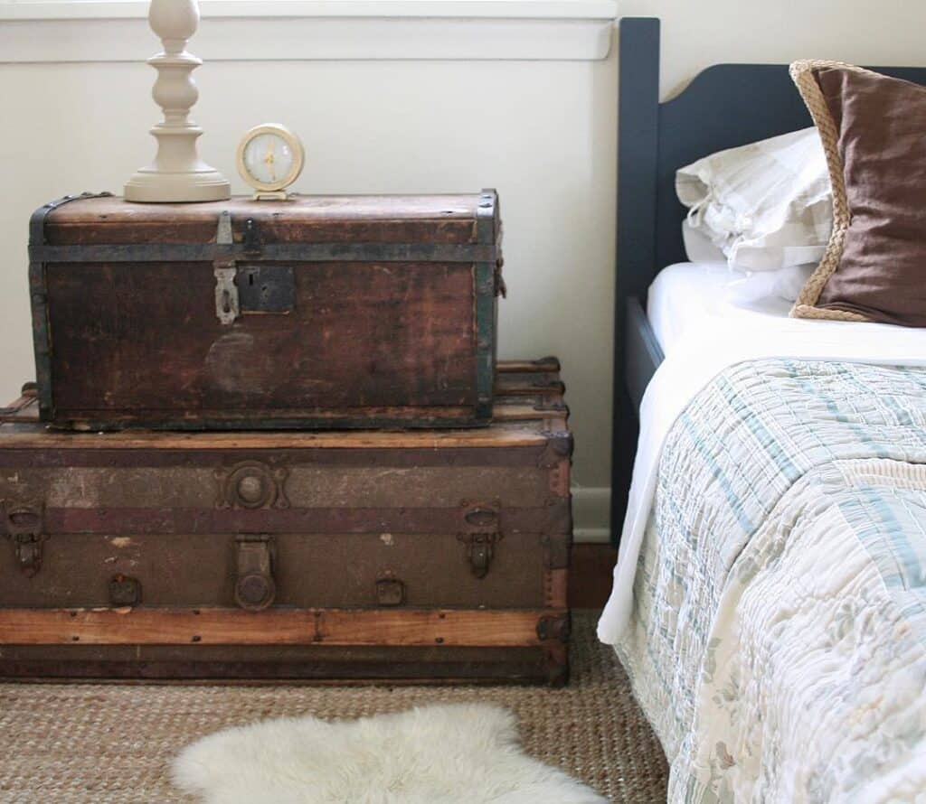 Two Wood Suitcases in a Bedroom