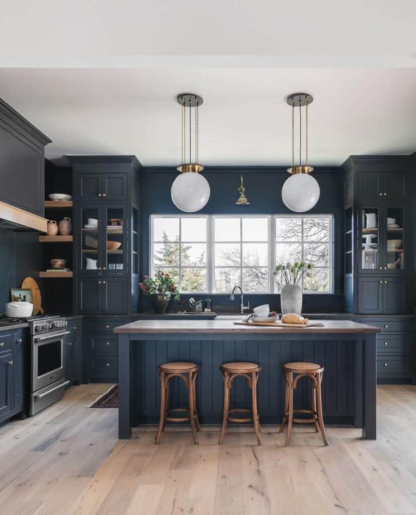 White Ball Pendant Lights Over Dark Grey Island