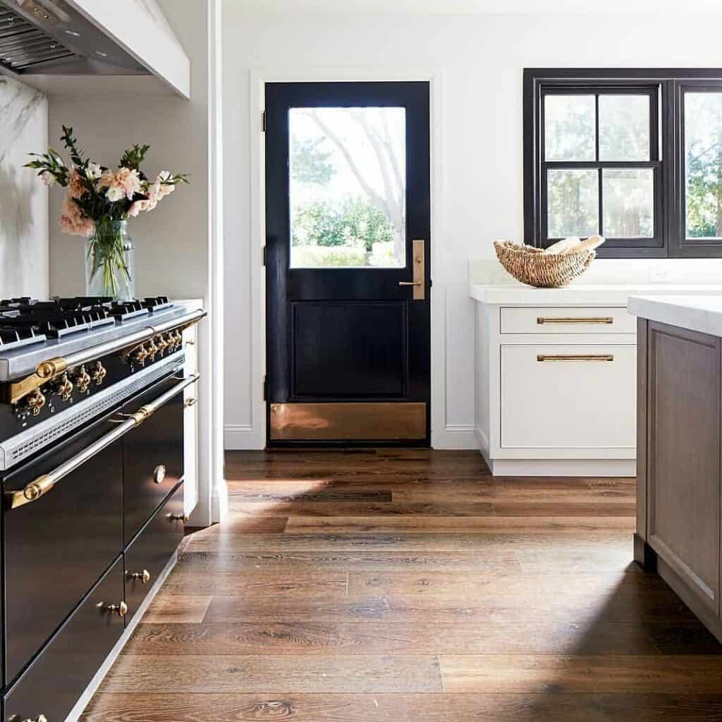 White Baseboard with Warm Wood Floors in a Kitchen