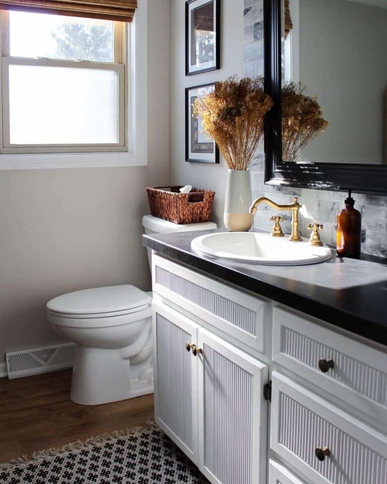 White Half Bath Vanity with Black Granite Countertop