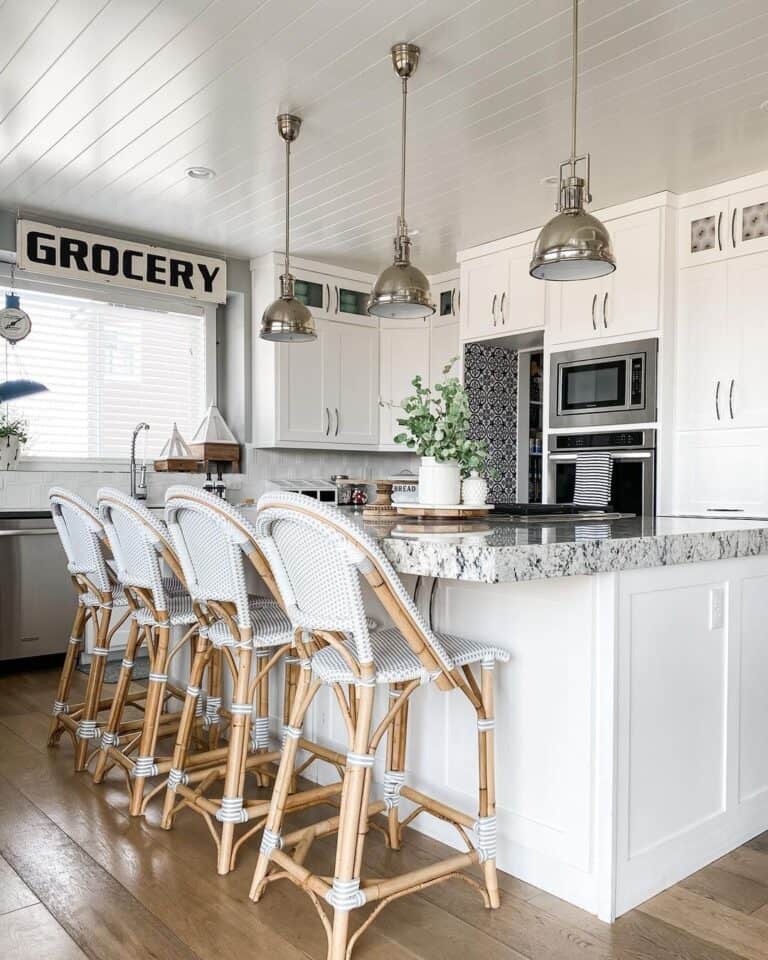White Kitchen Island with Rattan Counter Stools