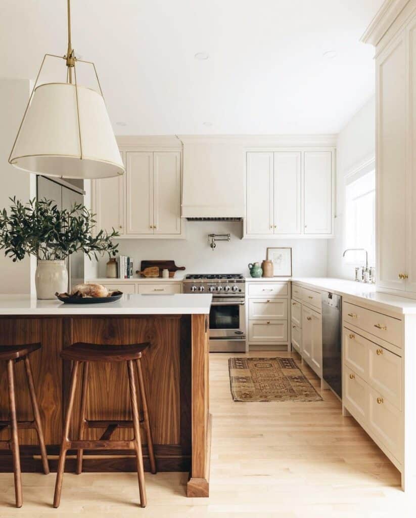 White Kitchen With Light Wood Flooring
