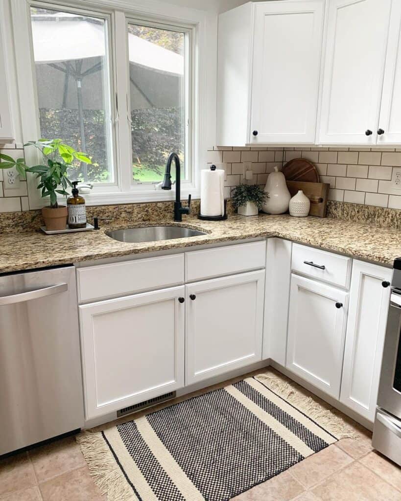 White Kitchen with Dark Cabinet Countertops