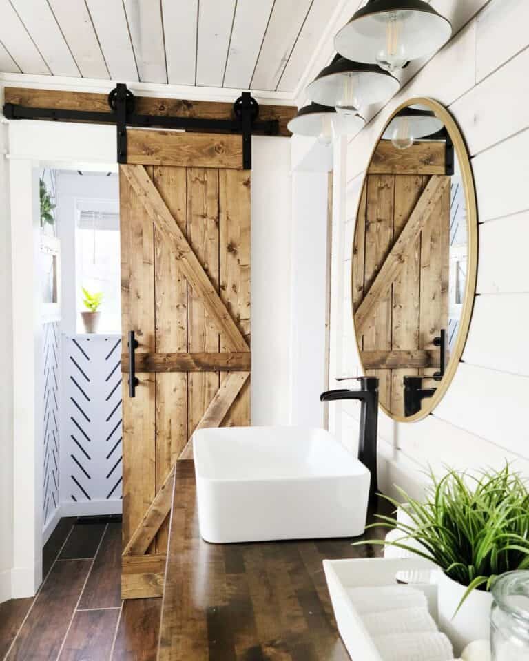 White Shiplap Bathroom with Brass Oval Mirror