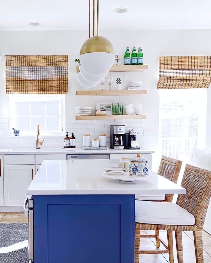 White and Gold Ball Lamps Over Blue Kitchen Island