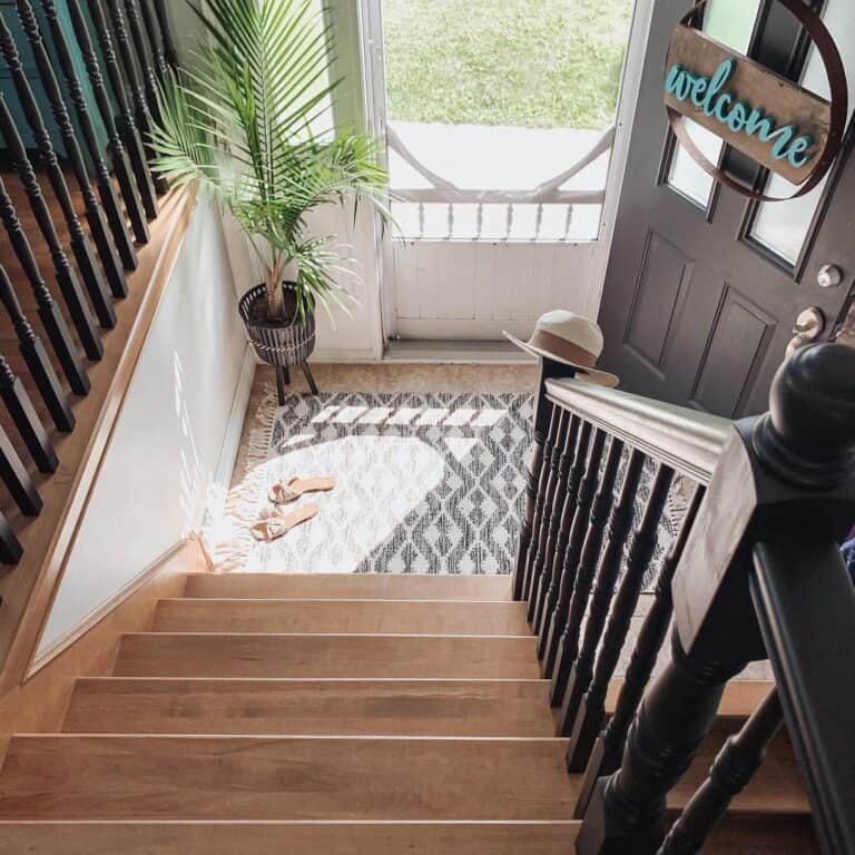 Wood Staircase Entryway with Black Spindles