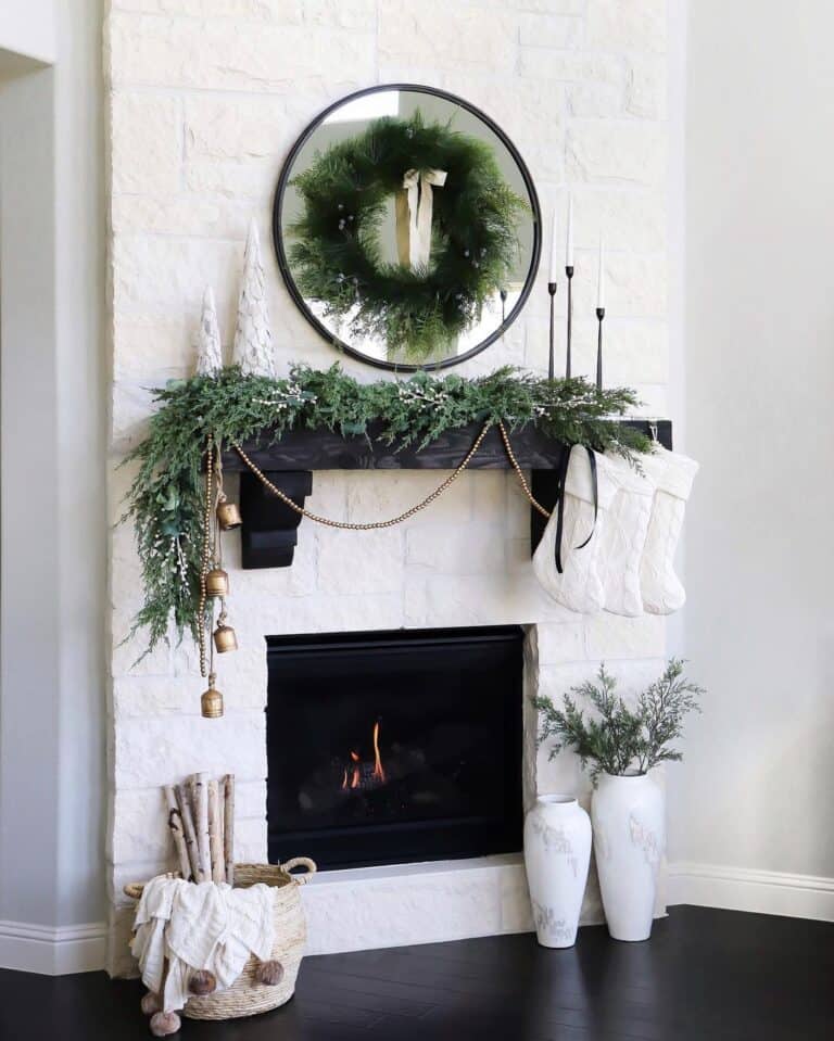 Black Fireplace Mantle with Green Garland