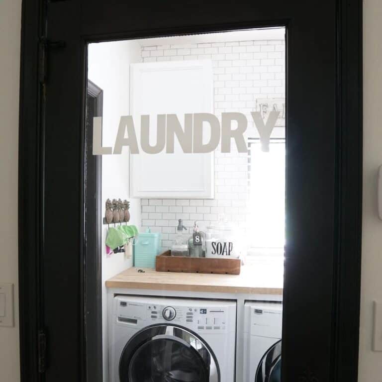 Black Laundry Door with Gray Letter Etching