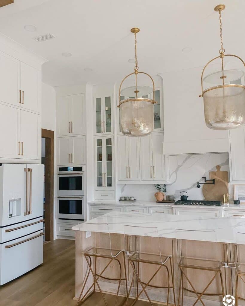 Brass Pendant Lighting and Glass Panel Cabinets