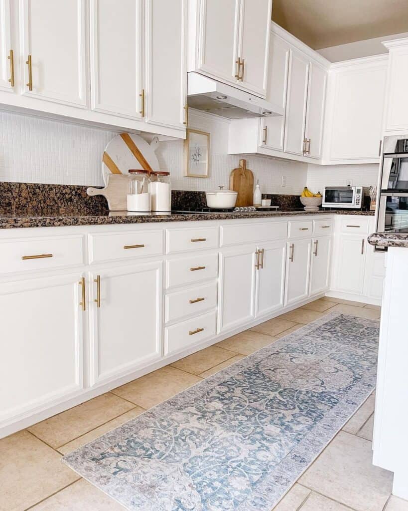 Brass Pulls on White Paneled Cabinets