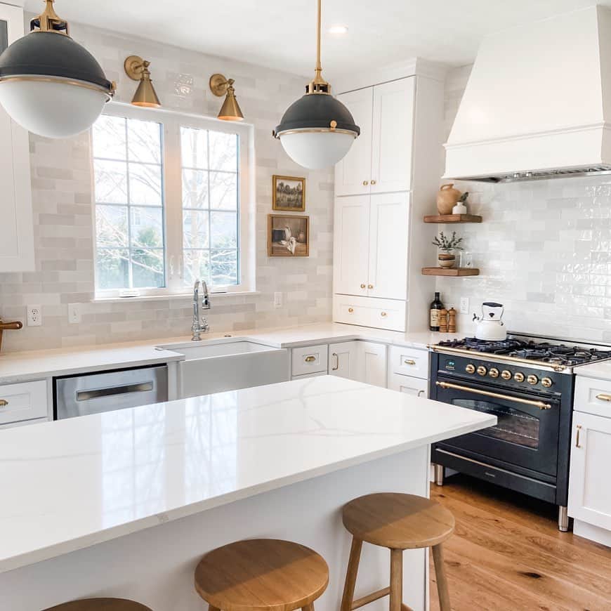 Brass Sconces Over White Kitchen Window