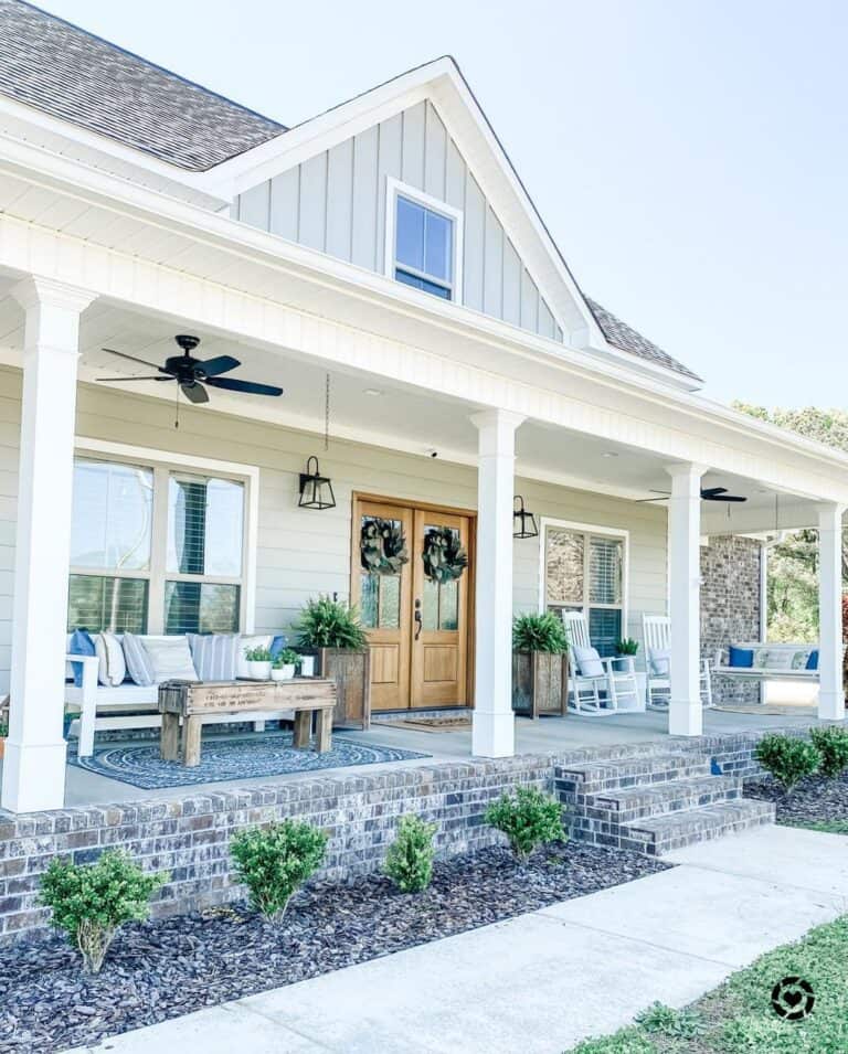 Brick Porch with White Bench Seating