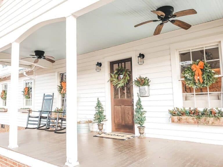 Christmas Themed Farmhouse Porch with Ceiling Fans