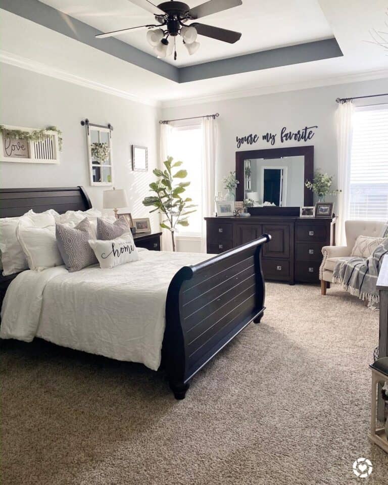Dark Wood Sleigh Bed with White Bedspread