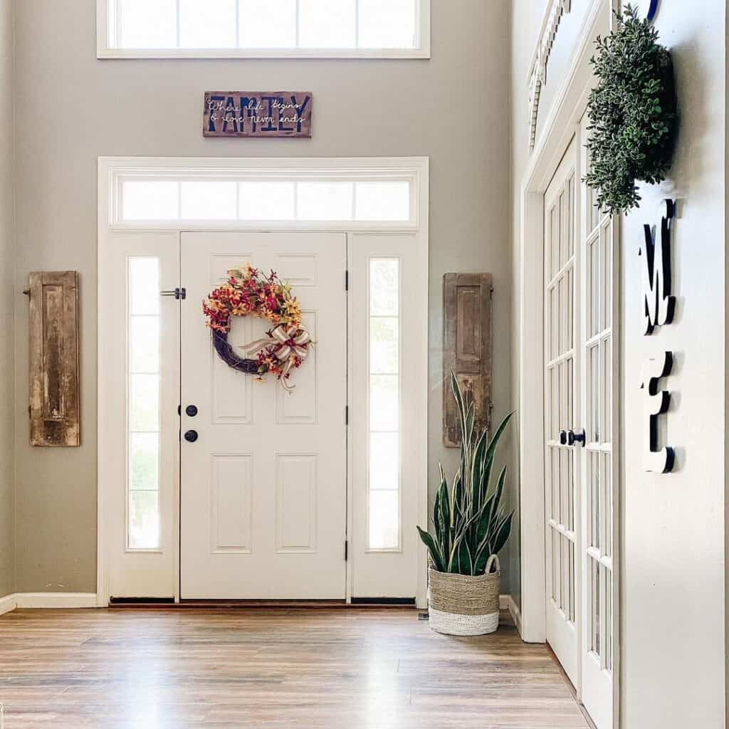 Entryway with White Front Door With Sidelights and Transom