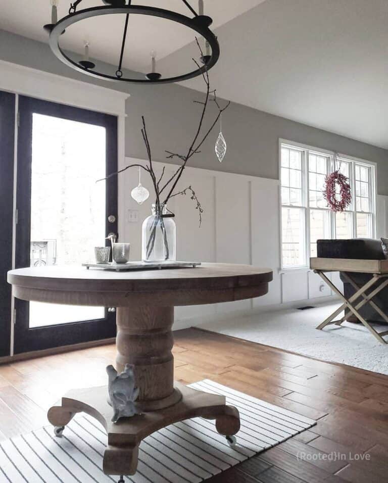 Farmhouse Chandelier Over Circular Wood Table