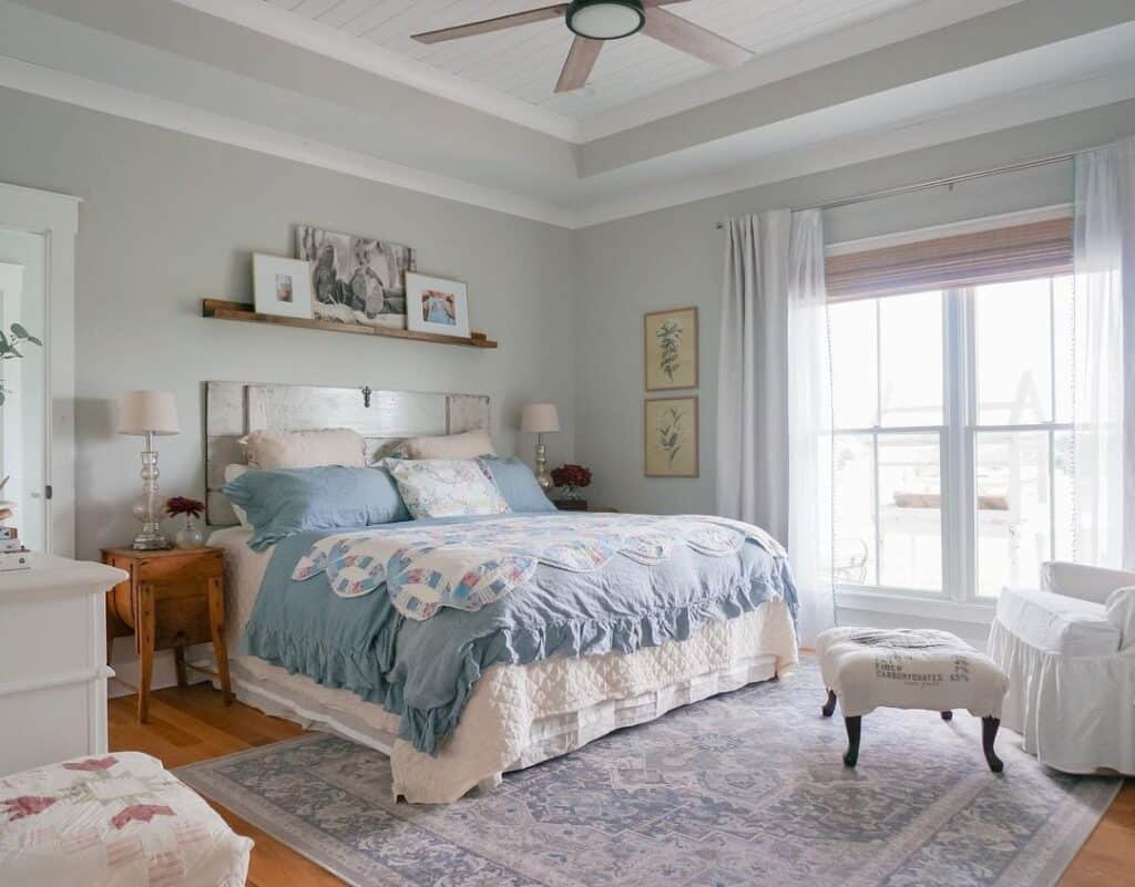 Floating Shelf Above White and Blue Bed