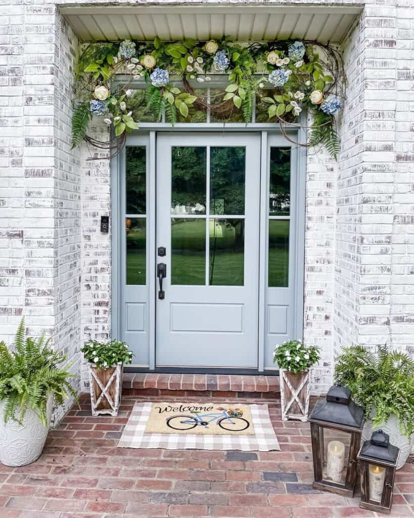 Grapevine Wreaths Above Front Door with Sidelights and a Transom