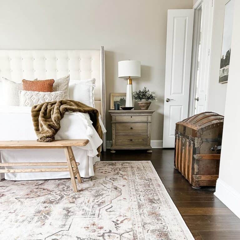 Grey Primary Bedroom with White Baseboards
