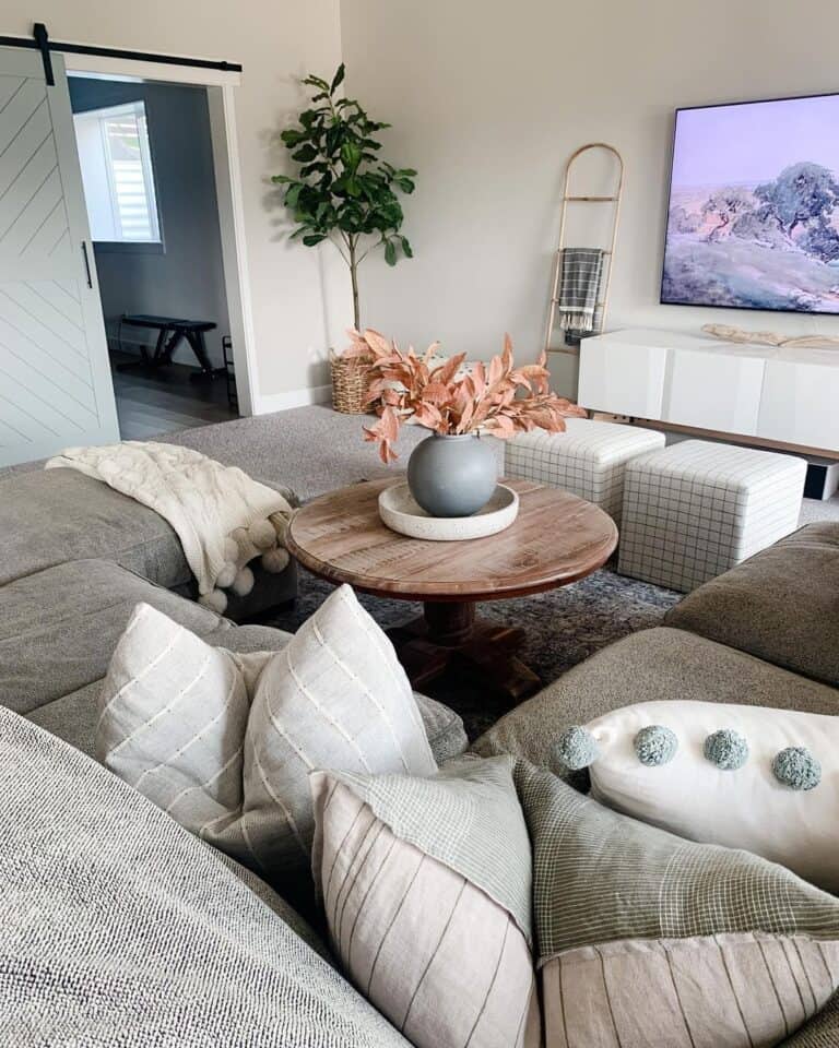Grey Sectional Couch with White and Sage Pillows