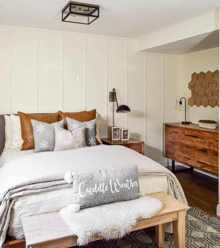 Light Grey Bedspread with White Paneled Wall