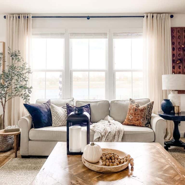 Living Room Farmhouse Windows with Beige Curtains