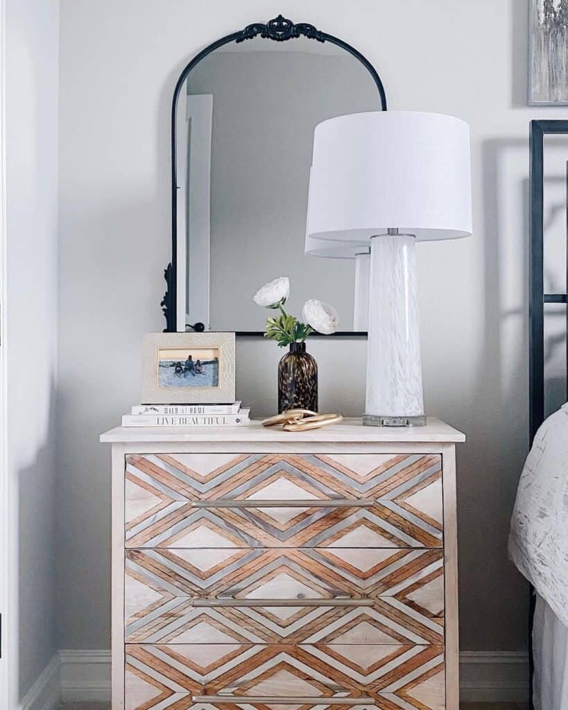 Long Bronze Pulls in a Grey Bedroom