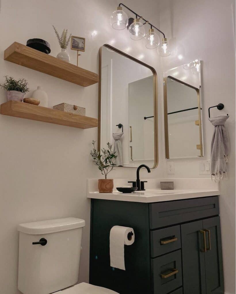 Mirrored Bathroom with Glass Vanity Lighting