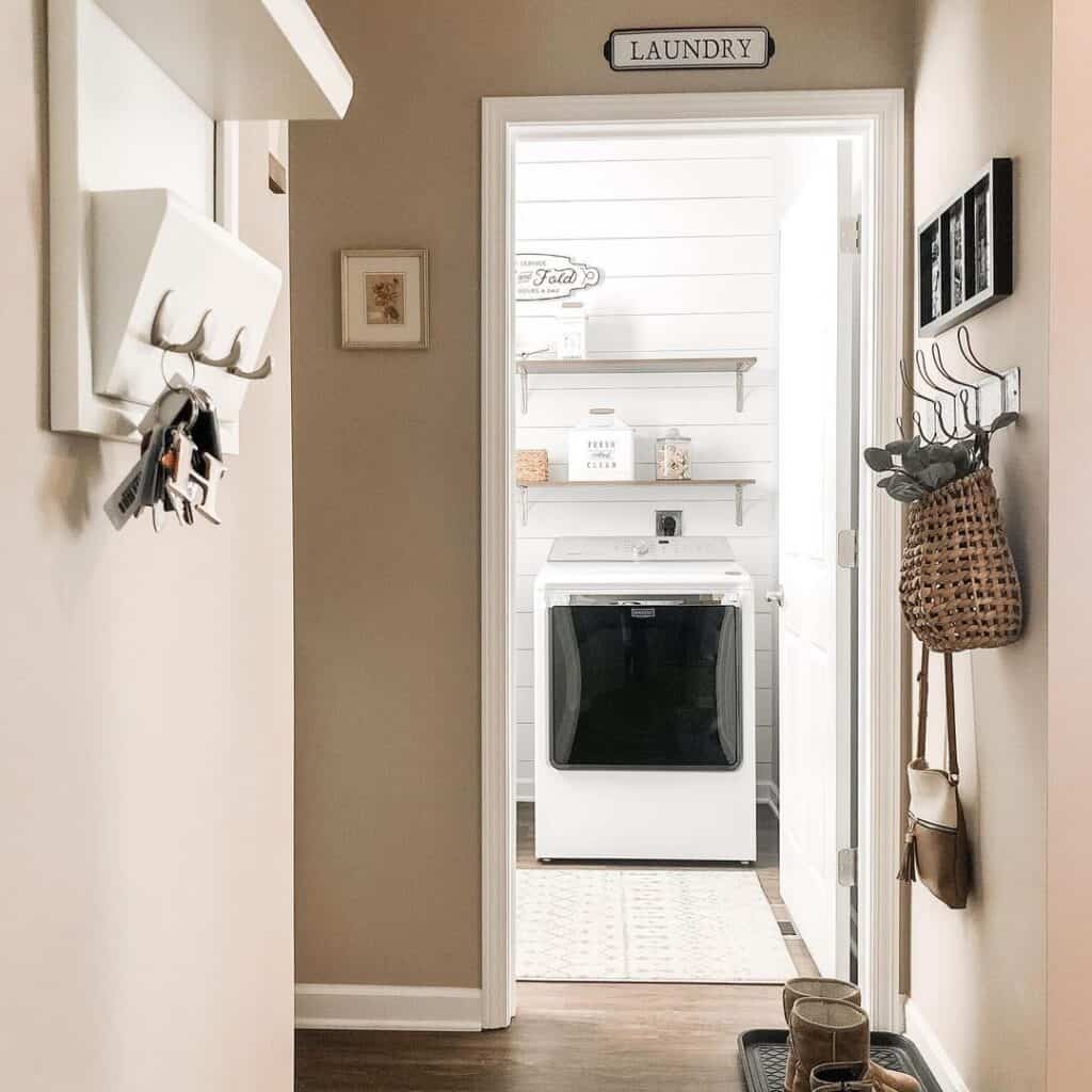 Narrow Hallway with White Laundry Door