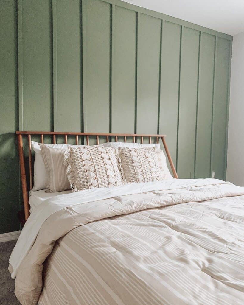 Neutral Bed Against Green Accent Wall