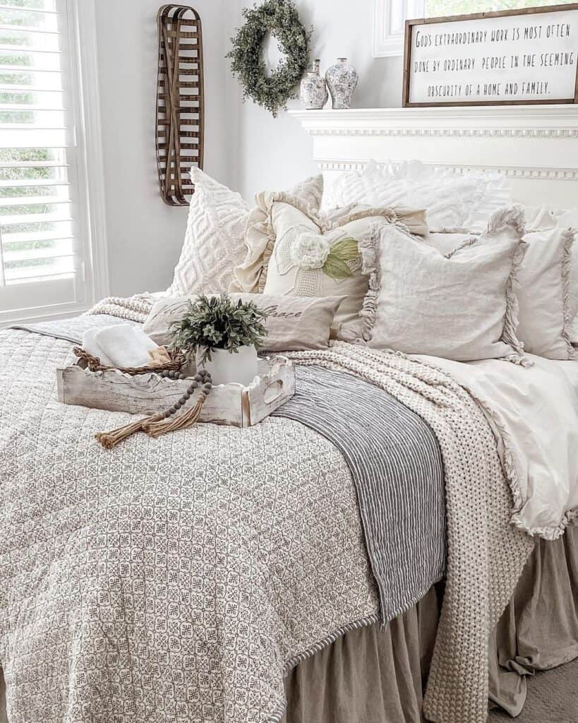 Ornate Bed with Beige and Grey Coverlets