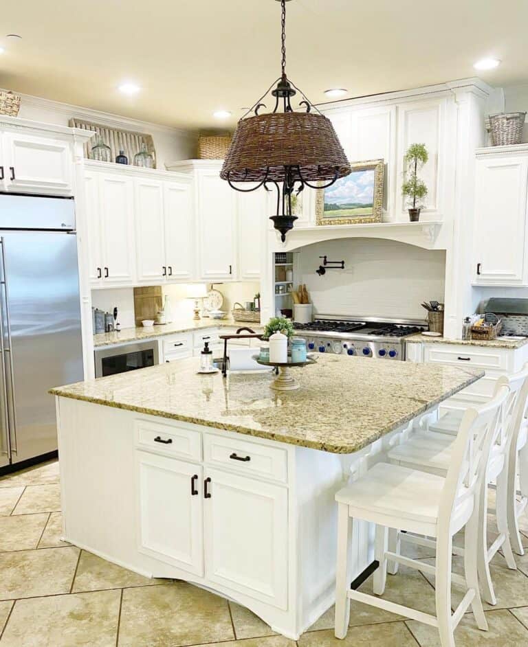 Ornate White Cabinets with Short Black Handles