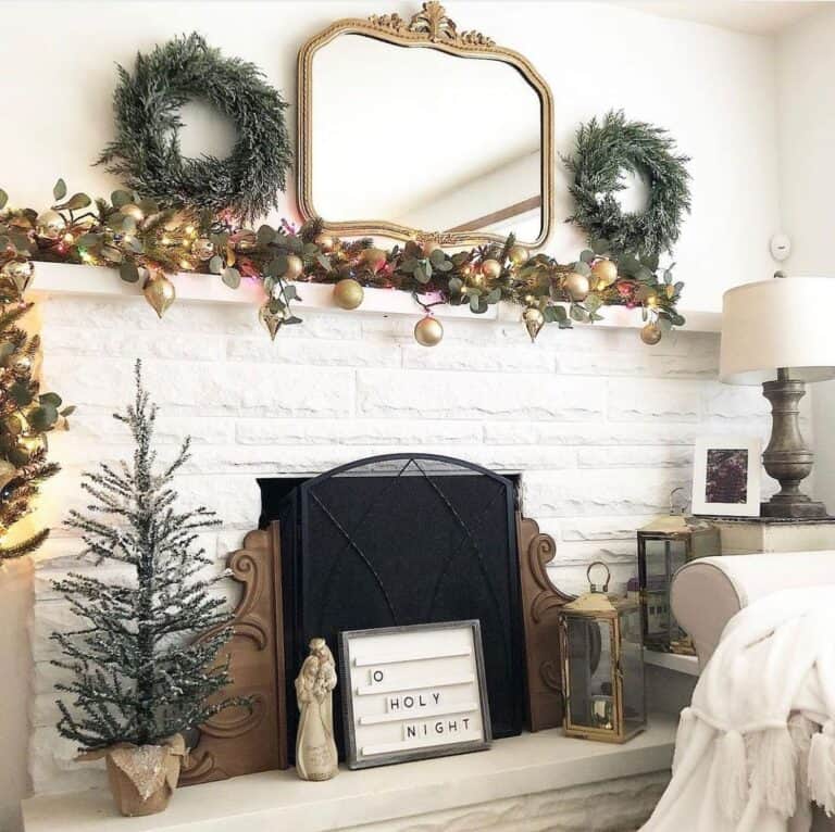 Painted White Brick Fireplace with Lanterns