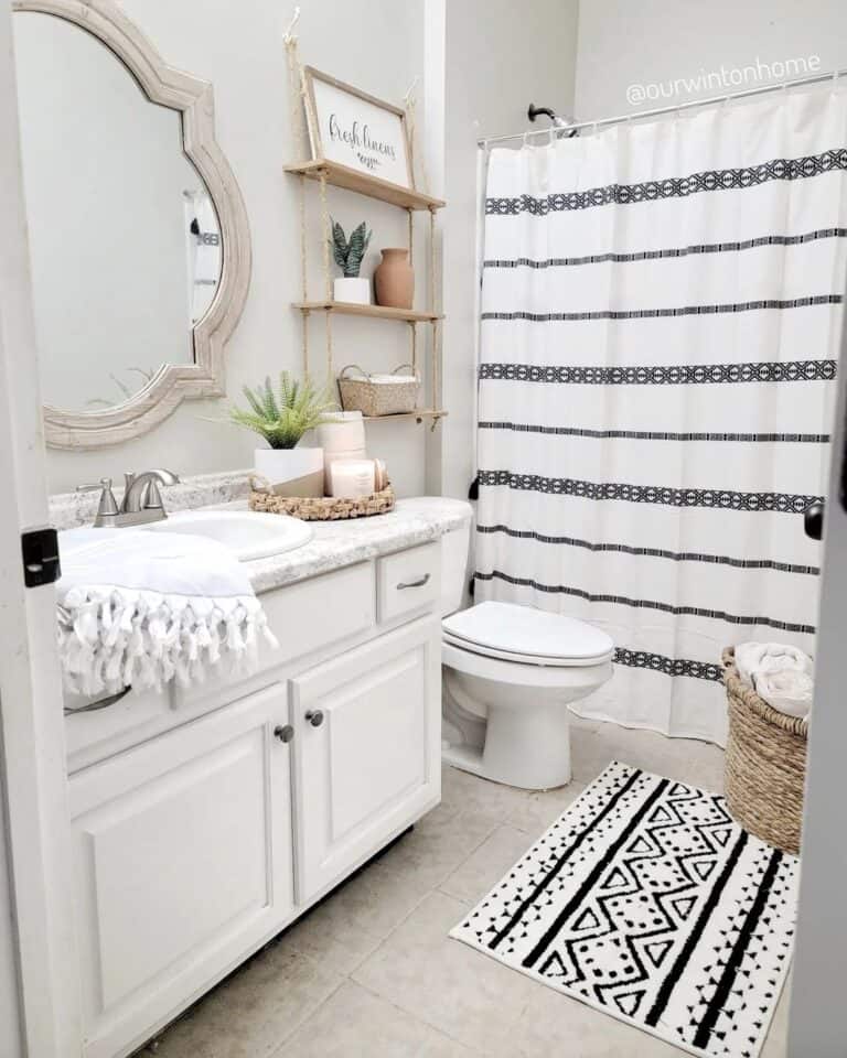 Patterned Accessories in Wood and White Bathroom