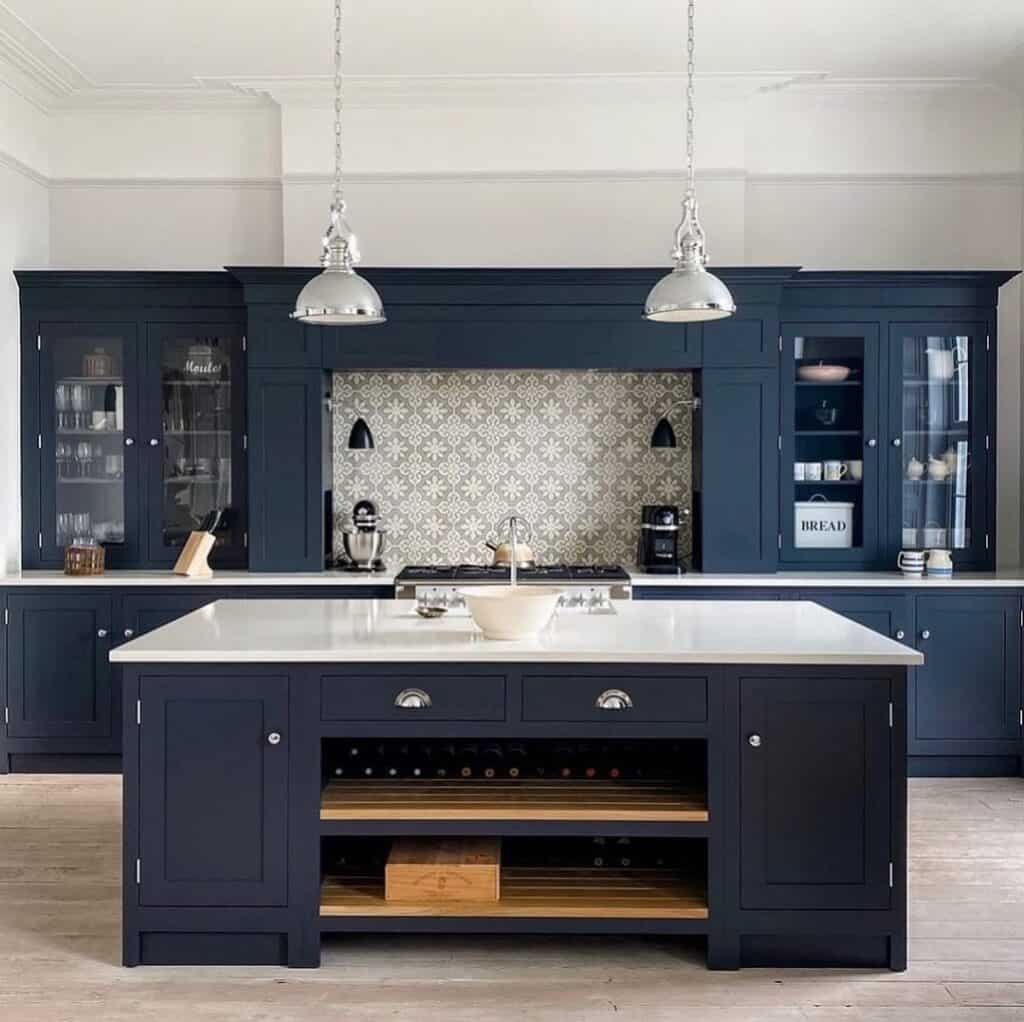 Patterned Backsplash Surrounded by Black Cabinets