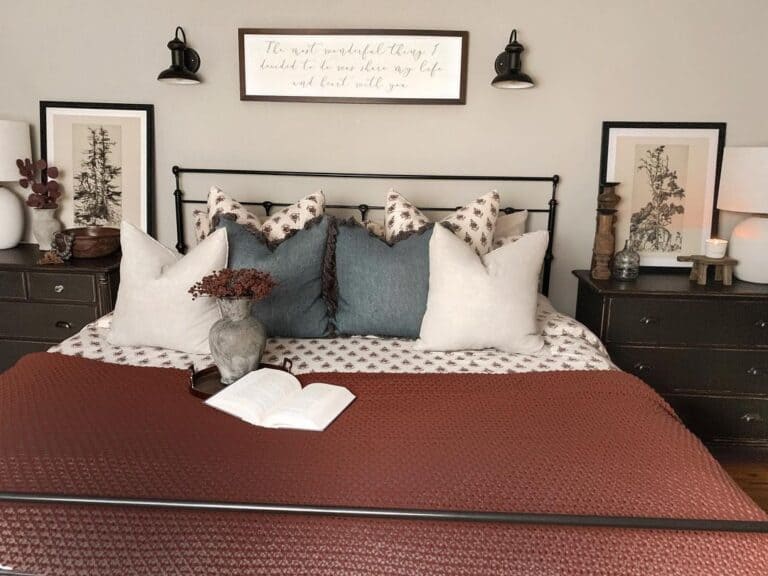 Rust-Colored Coverlet on Metal Bed