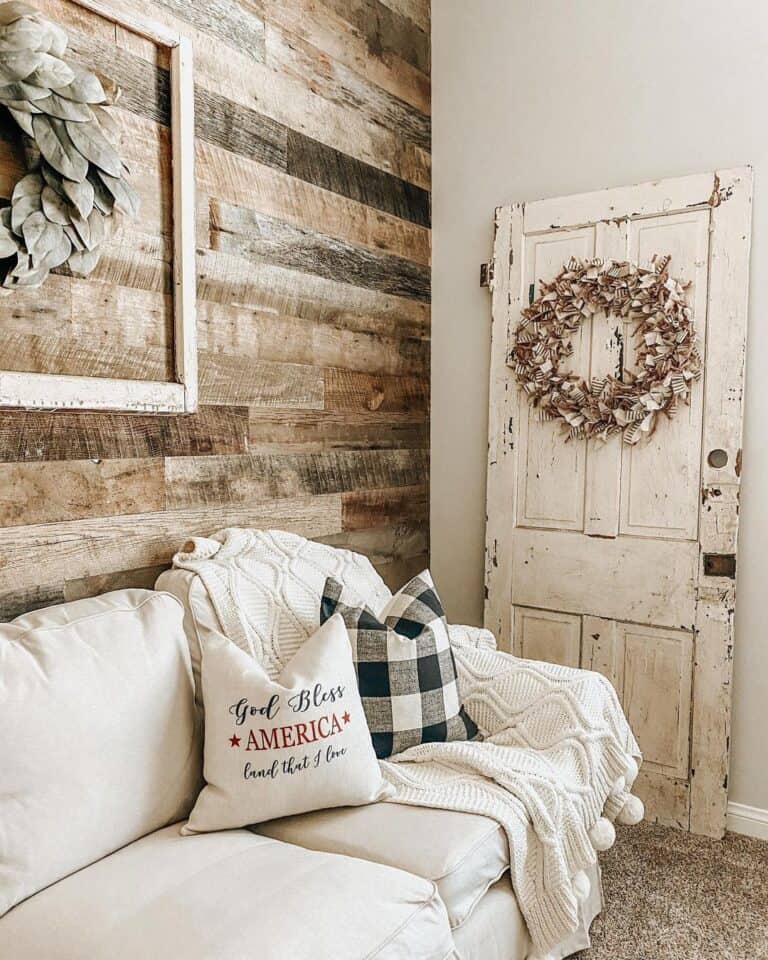 Rustic Shiplap Wall with Beige Couch Throw Pillows