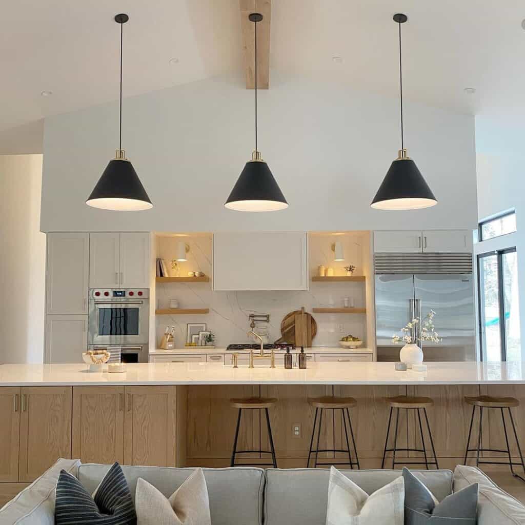 Shaded Black Pendants Over Wood Island