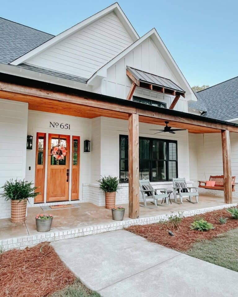 Textured Porch Displaying Wood Front Door