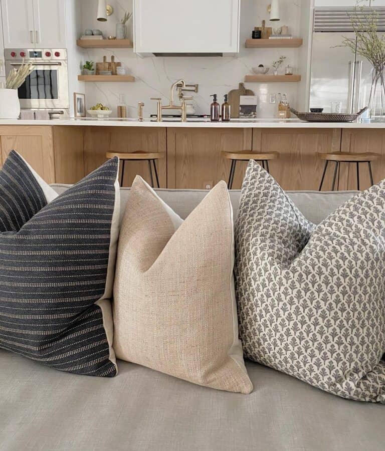 Three Throw Pillow Covers on Grey Sofa