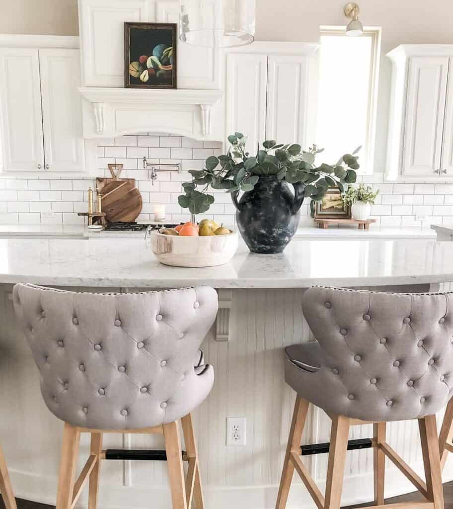 Upholstered Stools in All White Kitchen