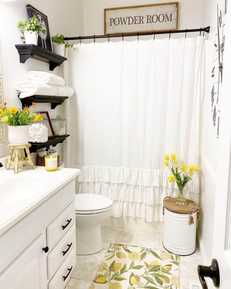 White Bathtub with White Ruffled Shower Curtain