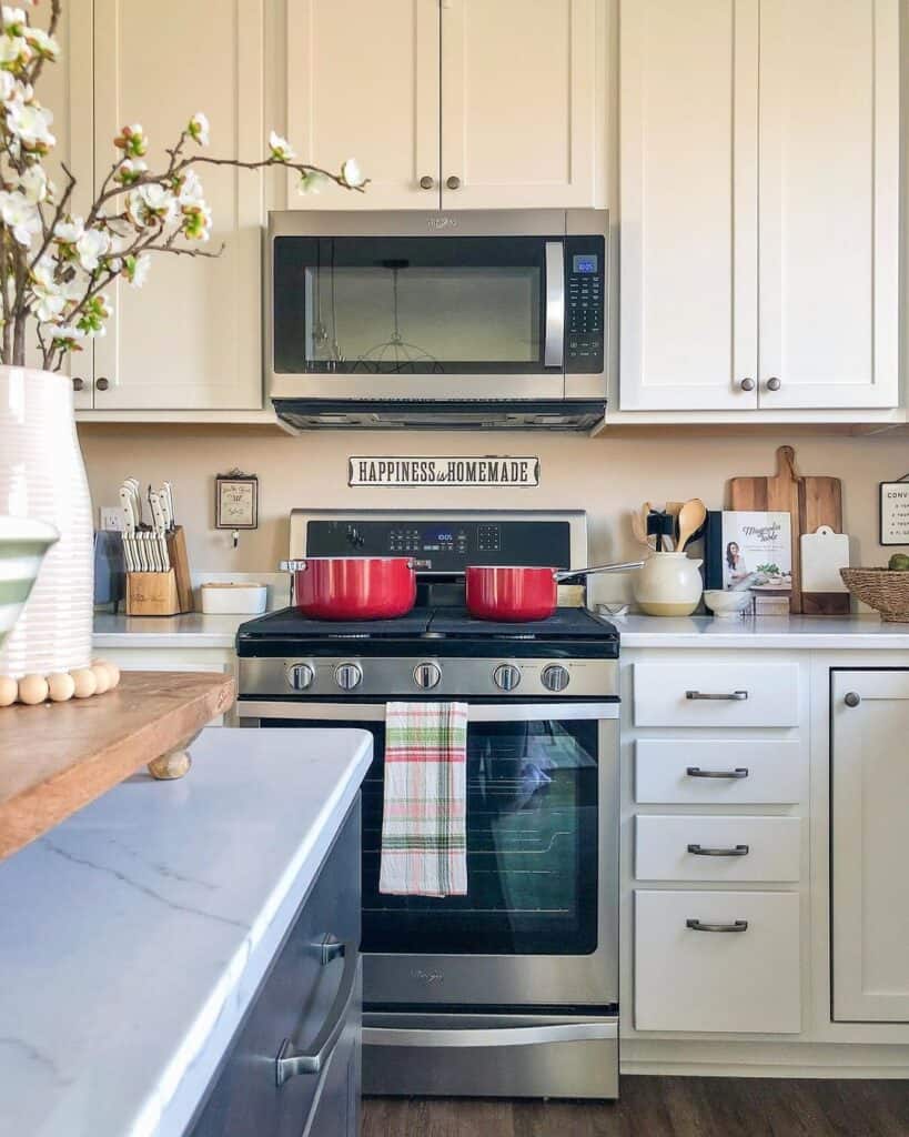 White Cabinets and Vibrant Red Cookware
