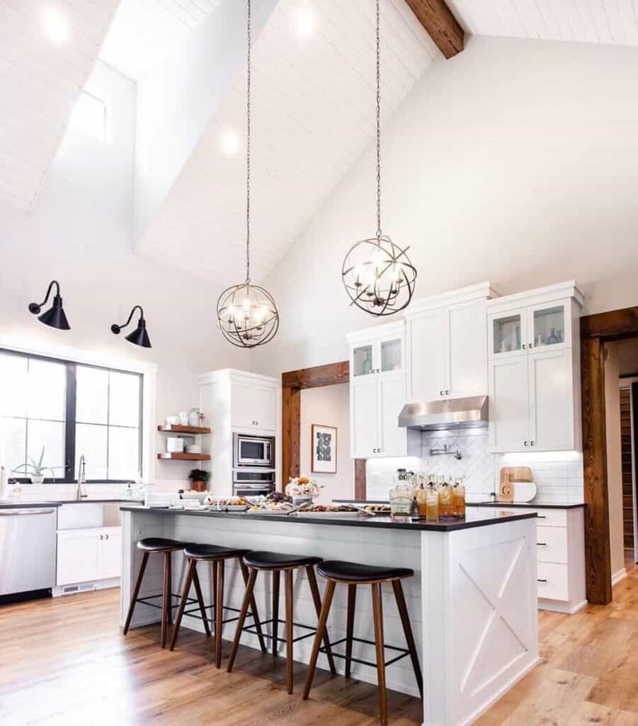 White Farmhouse Kitchen Island With Orb Pendants