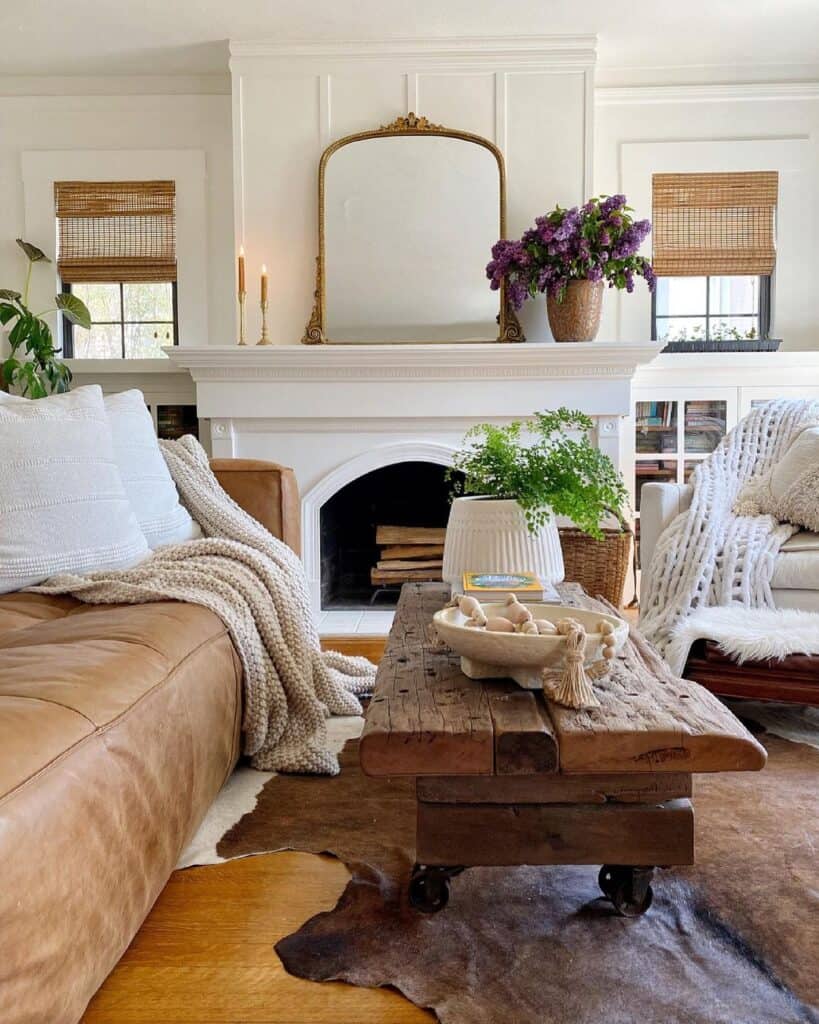 White Fireplace and Brown Leather Couch