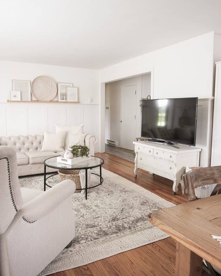 White Living Room With Circular Glass Table