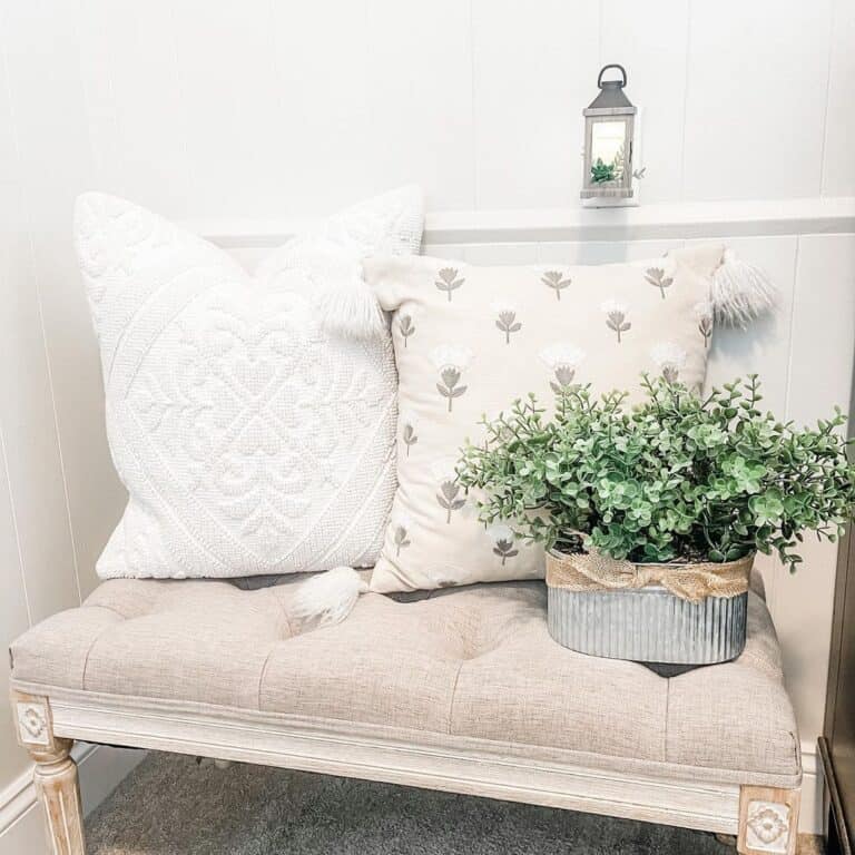 White and Beige Throw Pillows on Beige Bench