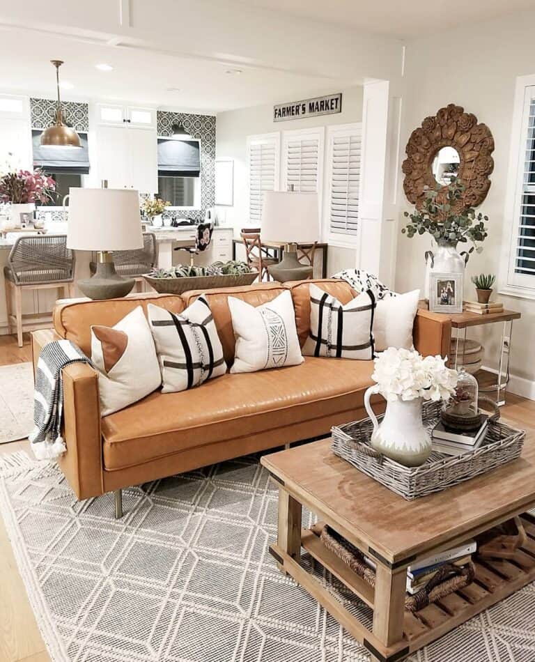 https://www.soulandlane.com/wp-content/uploads/2022/08/White-and-Black-Throw-Pillows-With-a-Modern-Brown-Leather-Couch-768x950.jpg